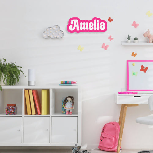 Custom acrylic kids’ room name plaque with colorful lettering and playful design, personalized for a child's bedroom decor.