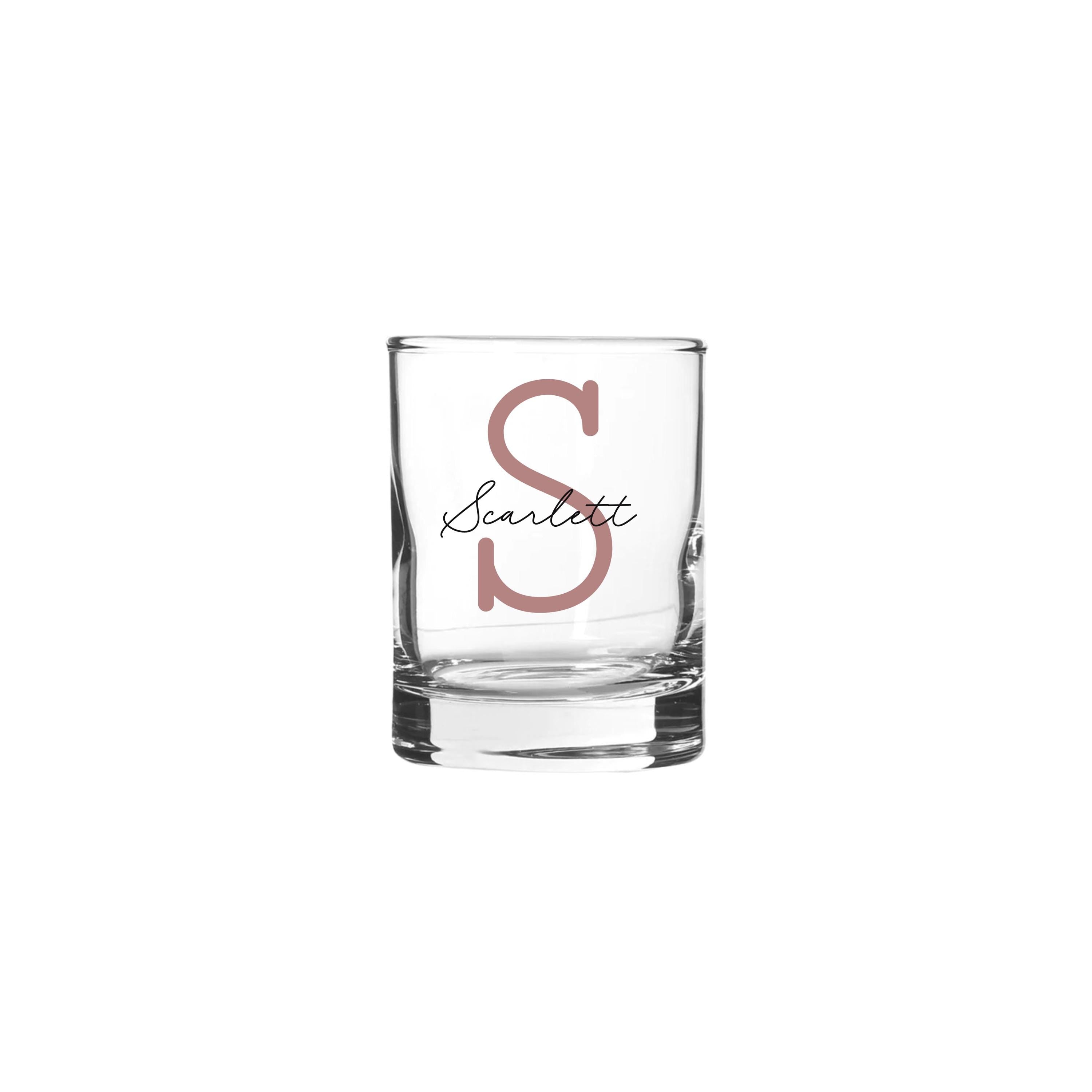 Personalised 65ml shot glass with monoline script and slab serif font, featuring custom text on a clear glass.