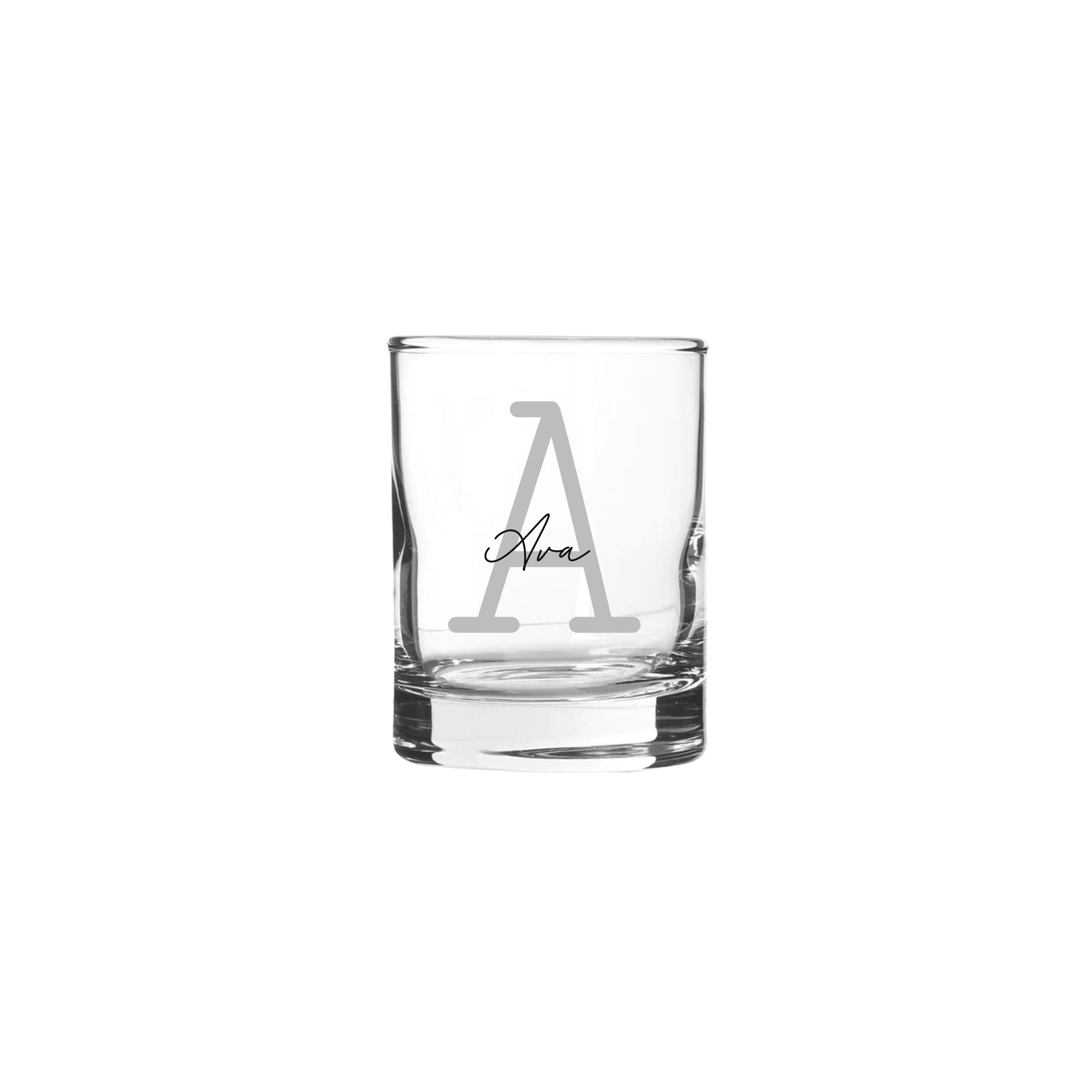 Personalised 65ml shot glass with monoline script and slab serif font, featuring custom text on clear glass.