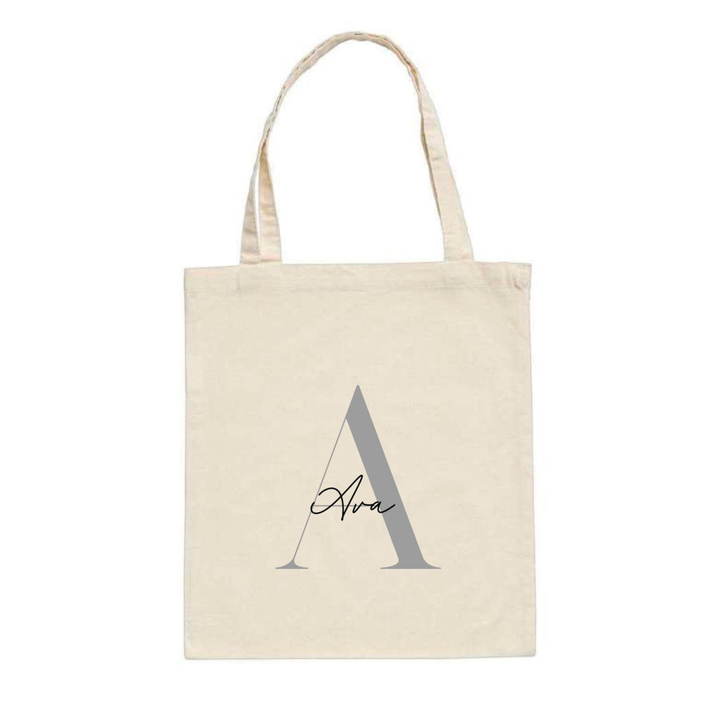 White personalised tote bag by Make It Personal Gift Co with elegant serif and script initials and name design.