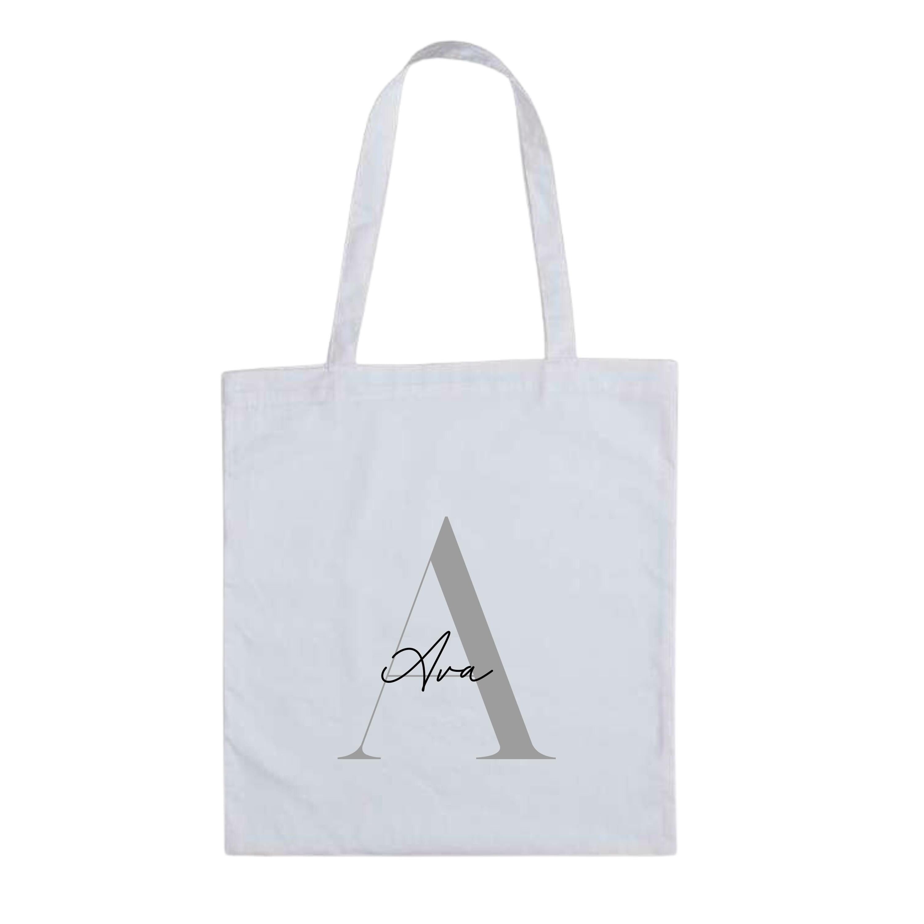 White personalised tote bag by Make It Personal Gift Co with elegant serif and script initials and name design.