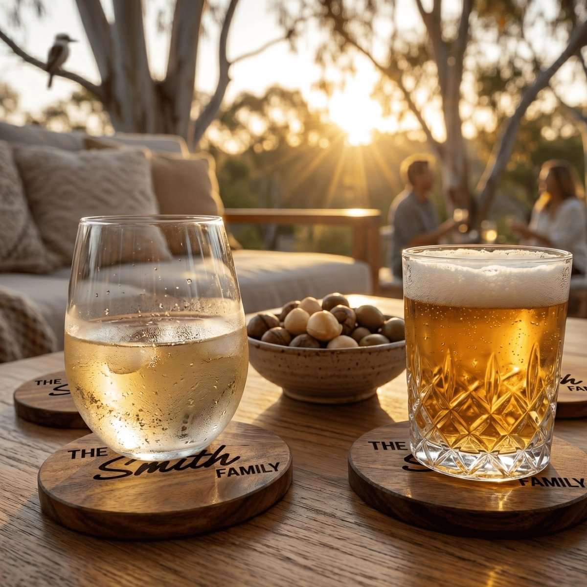Personalised engraved acacia timber coasters styled on an Australian coffee table with drinks.