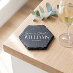 Personalised engraved geometric slate coaster styled with a glass mug on a timber coffee table in Australia.
