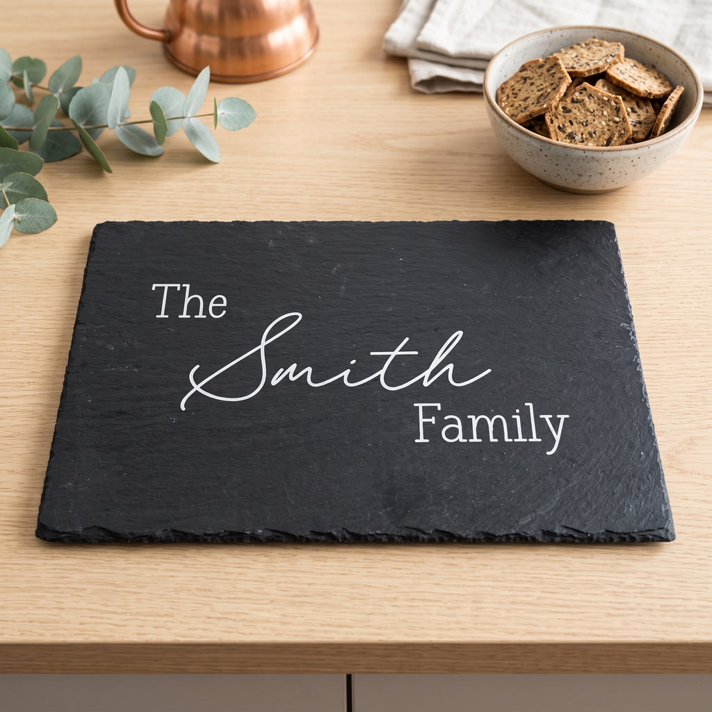 Personalised engraved 30cm x 20cm rectangular slate platter styled with artisanal cheeses and fruit on a table in Australia.