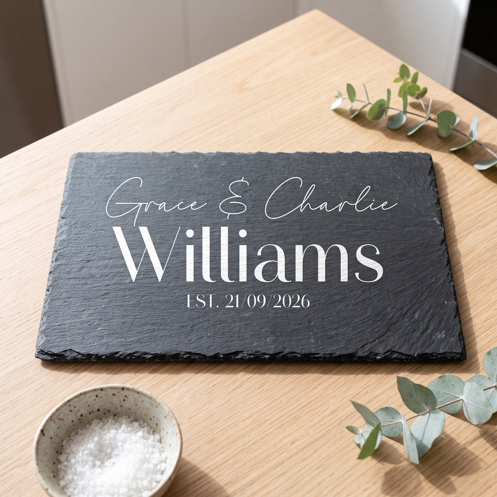 Personalised engraved rectangular slate platter styled with artisanal cheeses and fruit on a table in Australia.
