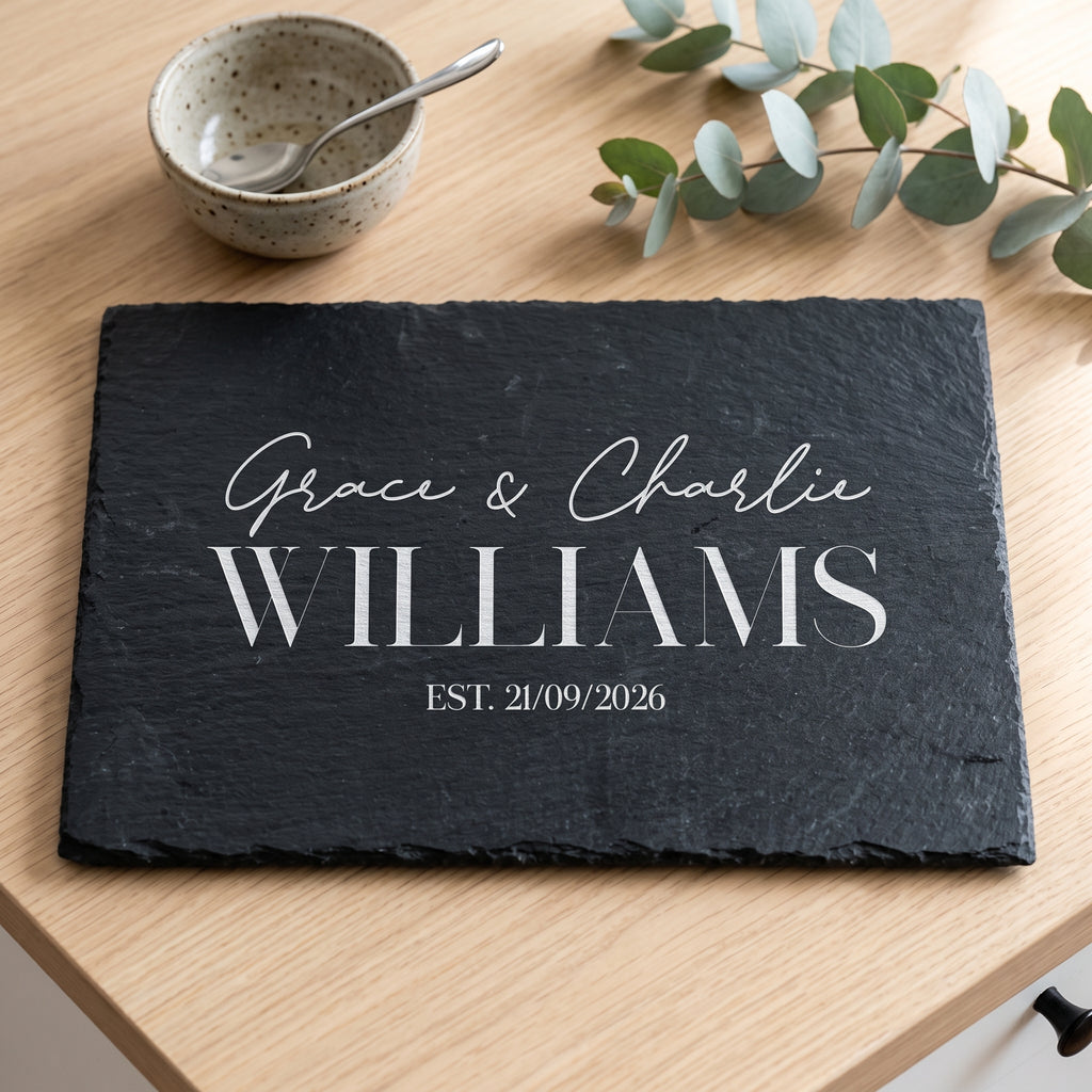 Personalised 30cm x 20cm rectangular slate platter laser engraved in Bespoke Heirloom script layout on dark stone surface.