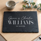 Personalised 30cm x 20cm rectangular slate platter laser engraved in Bespoke Heirloom script layout on dark stone surface.
