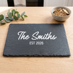 Personalised 30cm x 20cm rectangular slate platter laser engraved in Bold Contemporary font layout on dark stone surface.
