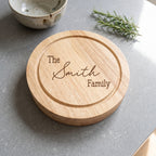 Personalised engraved round cheese board presented with cheese and fruit for a family gathering in Australia.