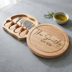Personalised engraved round cheese board presented with cheese and fruit for a family gathering in Australia.