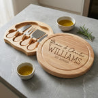 Personalised round swivel cheese board engraved in Timeless Classic font layout on natural timber surface.