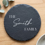 Personalised 30cm round slate platter laser engraved in Bespoke Heirloom script layout on dark stone surface.