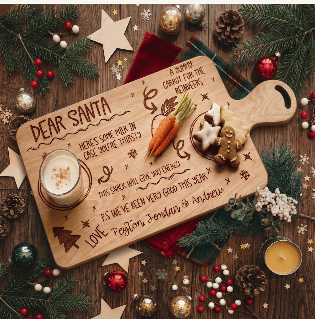 Personalised Christmas Eve Santa treat board engraved with family name holding milk and cookies on a wooden table