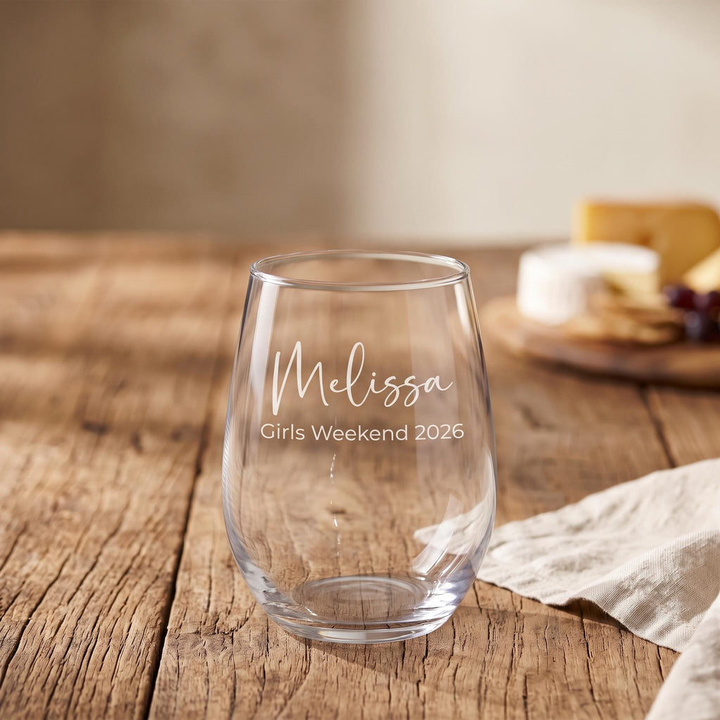 Personalised stemless wine glass engraved with a custom name and event title for a special celebration.