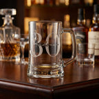 Personalised glass beer mug featuring a classic round monogram engraving, custom beer stein for birthday gifts and celebrations