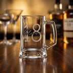 Personalised glass beer mug featuring a modern circular monogram font and milestone number, custom beer stein for birthday gifts