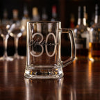 Personalised glass beer mug featuring a modern circular monogram font and milestone number, custom beer stein for birthday gifts