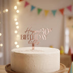 Personalised rose gold mirror acrylic cake topper featuring Happy 30th Birthday Kelly on a dessert table.