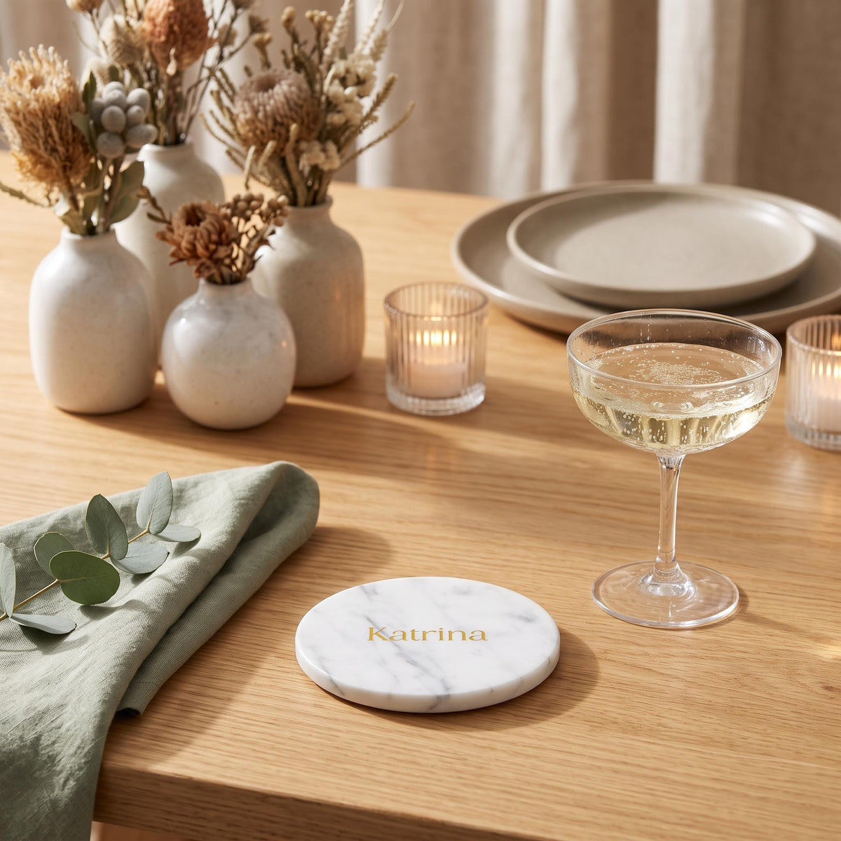 Personalised round marble coasters wedding place cards featuring custom engraved guest names on circular white marble, handcrafted by Make It Personal Gift Co in Australia.