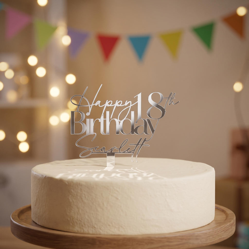 Bespoke silver mirror acrylic cake topper showing Happy 18th Birthday Scarlett on a smooth iced round cake.