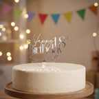 Bespoke silver mirror acrylic cake topper showing Happy 18th Birthday Scarlett on a smooth iced round cake.