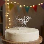 Bespoke silver mirror acrylic cake topper showing Happy 18th Birthday Scarlett on a smooth iced round cake.