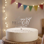Bespoke silver mirror acrylic cake topper showing Happy 18th Birthday Scarlett on a smooth iced round cake.